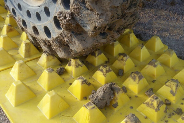 Close up of tyres being cleaned of mud