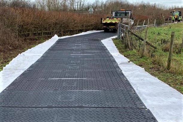 Temporary access road through woodland farm land