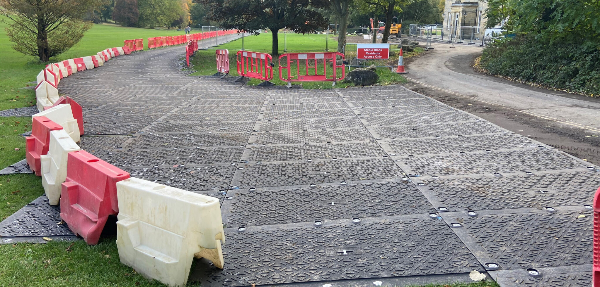 Temporary roadway across public park grass field local authority