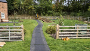 Temporary ground protection for mini digger across grass lawn